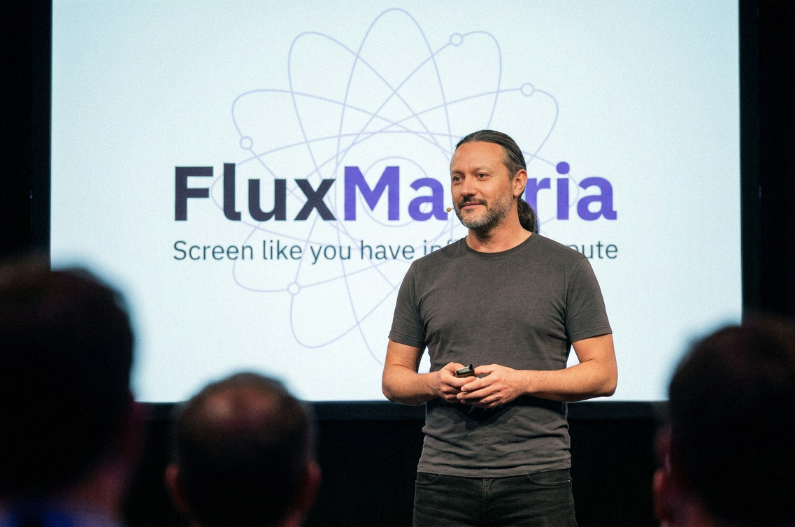 Roberto Campus presenting FluxMateria at a conference